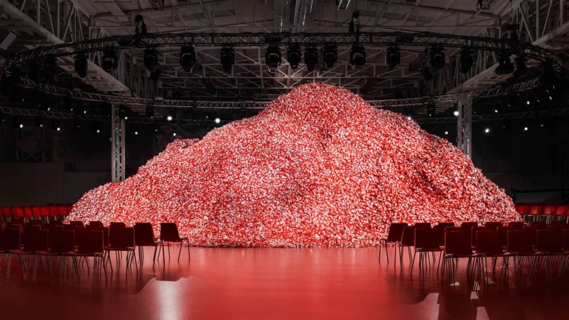 Models Parade Around An Installation Of 200,000 Condoms At Milan Fashion Week